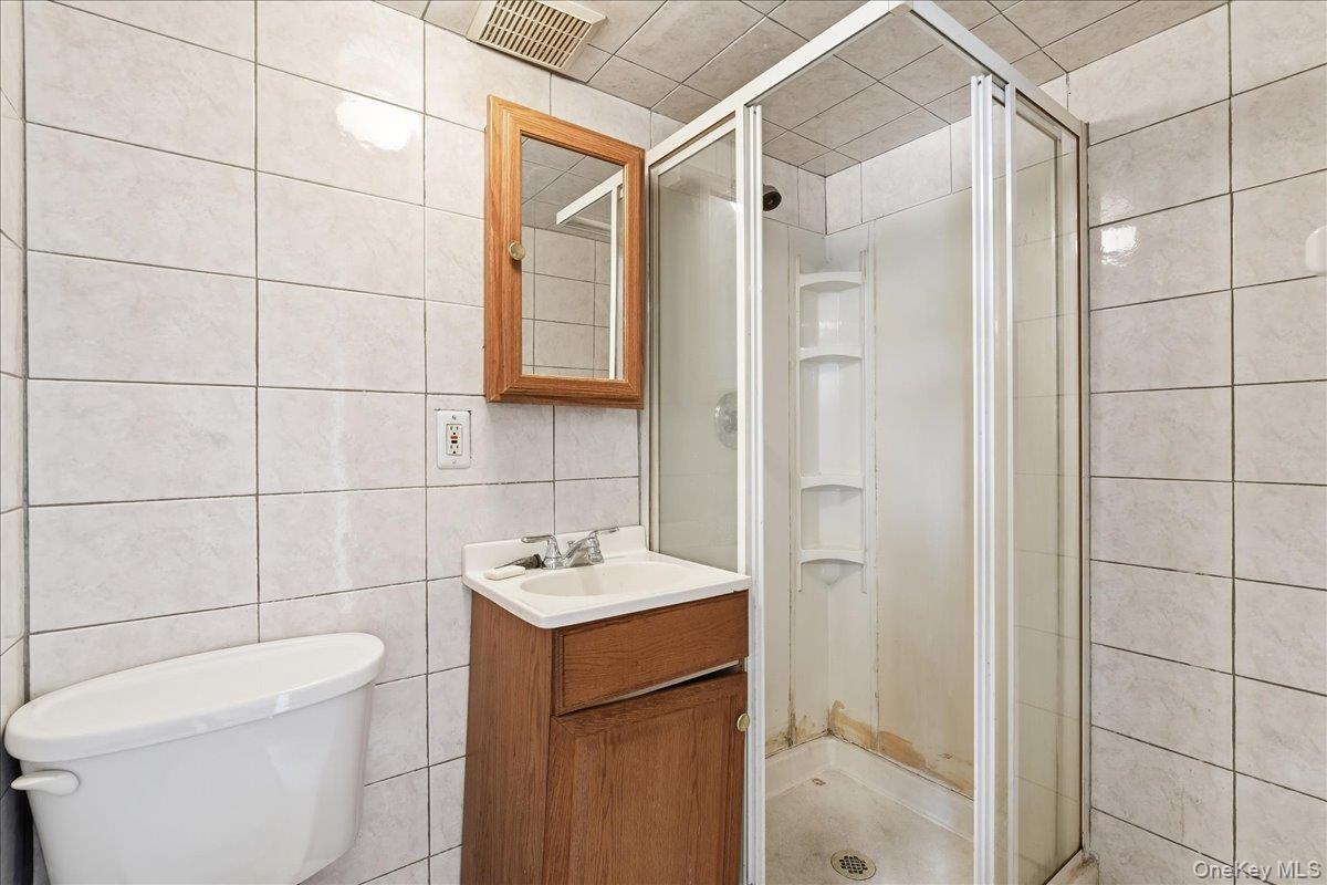 1050 Rensselaer Avenue Staten Island, NY 10309 - Photo 11 of 24 a bathroom with a sink toilet and shower