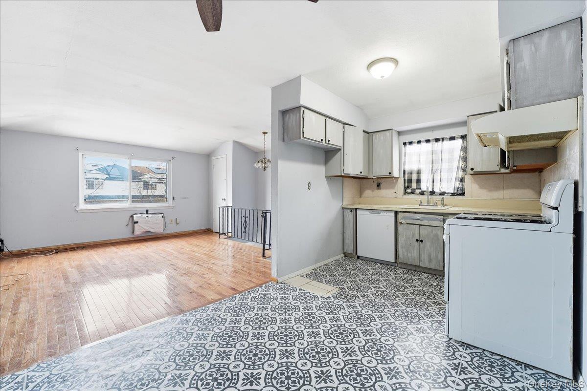 1050 Rensselaer Avenue Staten Island, NY 10309 - Photo 17 of 24 a kitchen with a refrigerator sink and cabinets