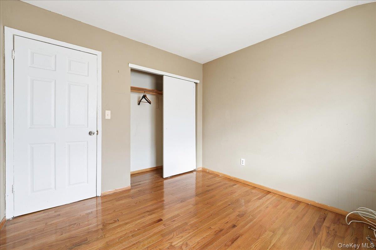 1050 Rensselaer Avenue Staten Island, NY 10309 - Photo 18 of 24 a view of an empty room with wooden floor and closet