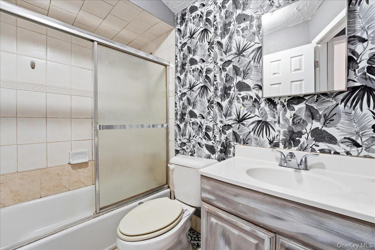 1050 Rensselaer Avenue Staten Island, NY 10309 - Photo 20 of 24 a bathroom with a sink toilet and shower
