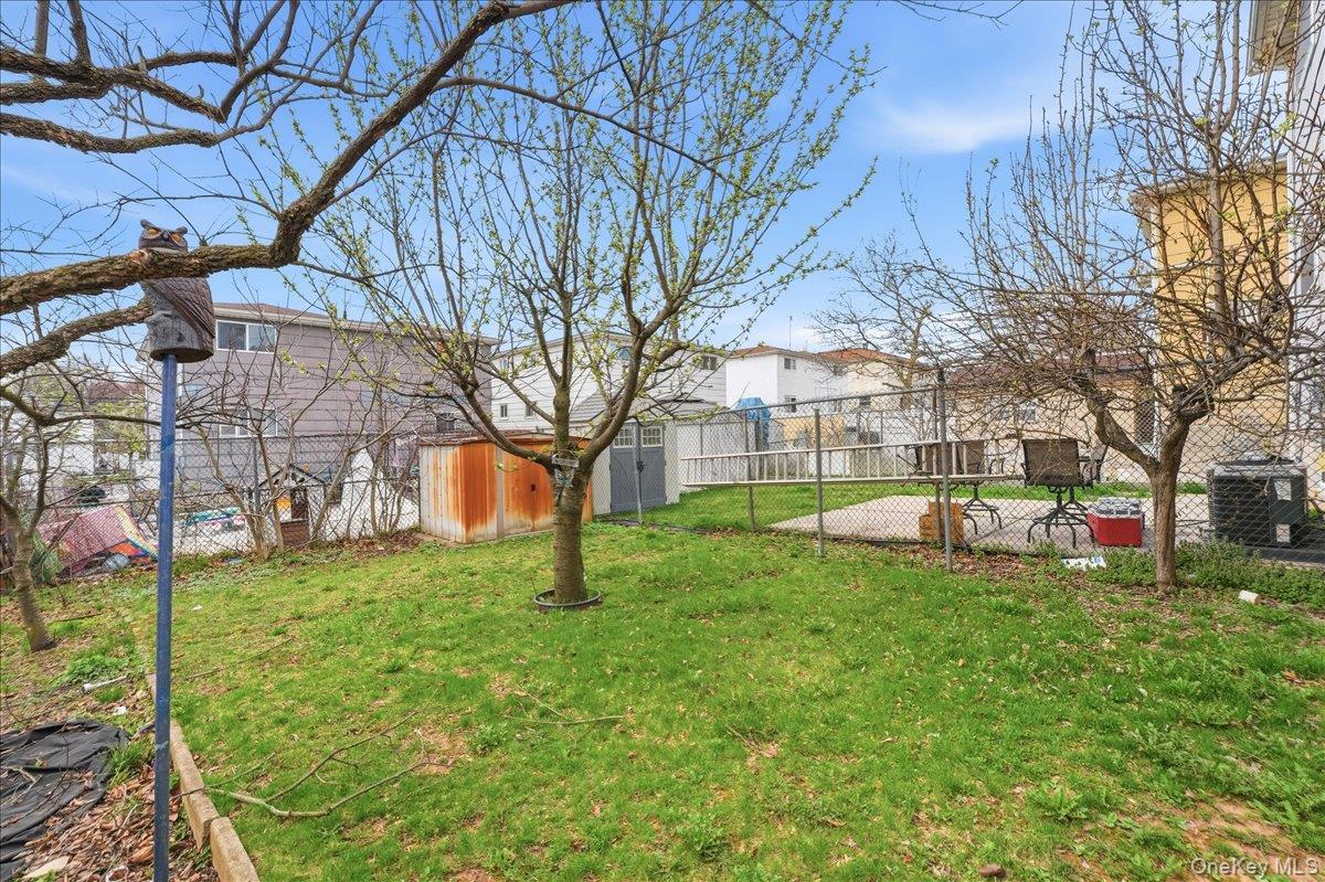 1050 Rensselaer Avenue Staten Island, NY 10309 - Photo 22 of 24 a view of a house with a backyard