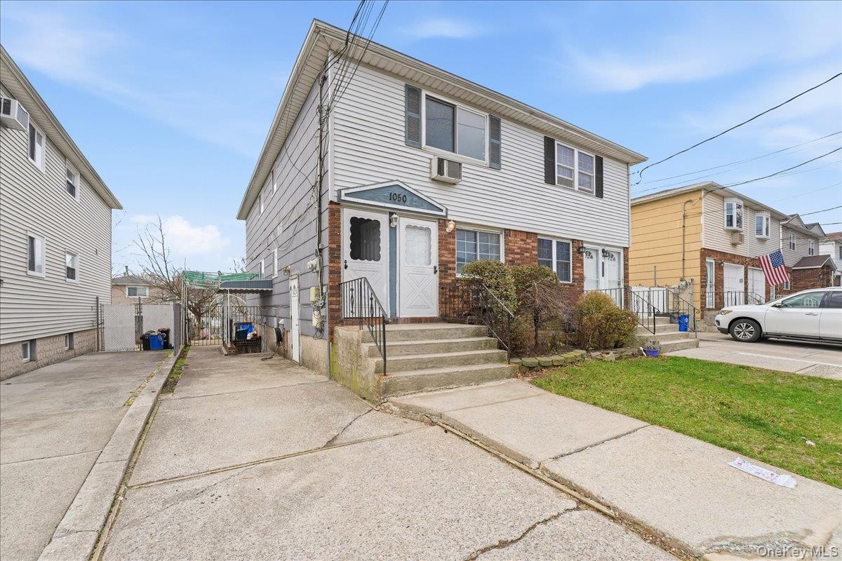 1050 Rensselaer Avenue Staten Island, NY 10309 - Photo 24 of 24 a front view of a house with a garden
