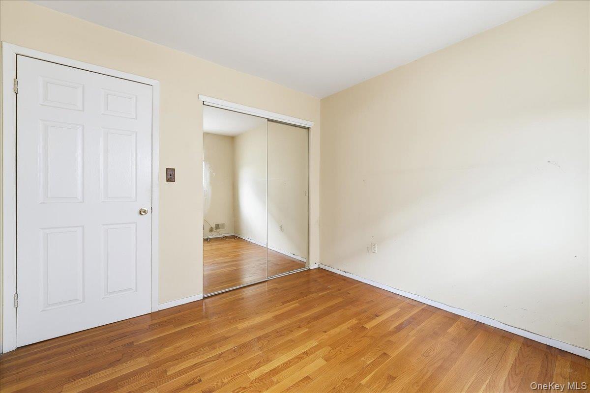 1050 Rensselaer Avenue Staten Island, NY 10309 - Photo 3 of 24 a view of empty room with wooden floor and entryway