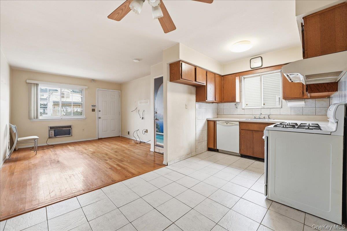 1050 Rensselaer Avenue Staten Island, NY 10309 - Photo 8 of 24 a kitchen with stainless steel appliances granite countertop a stove top oven a sink a counter space and cabinets