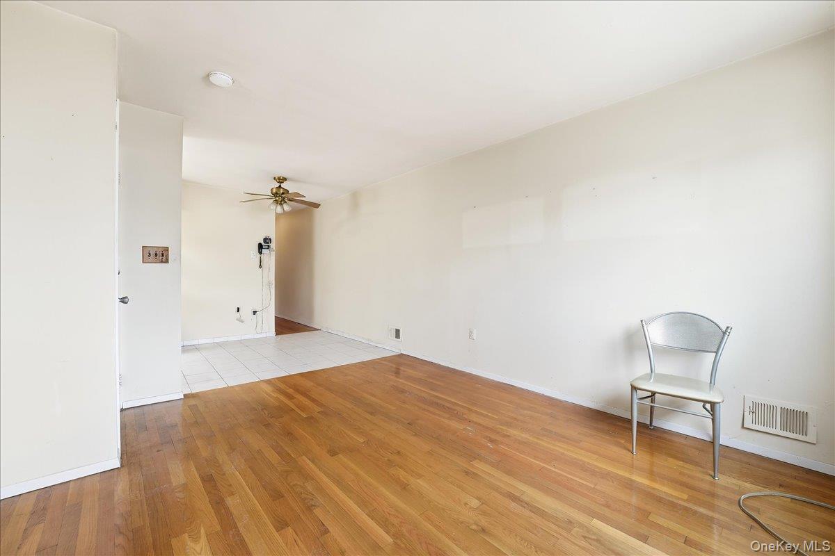 1050 Rensselaer Avenue Staten Island, NY 10309 - Photo 9 of 24 a bedroom with a bed and a chair