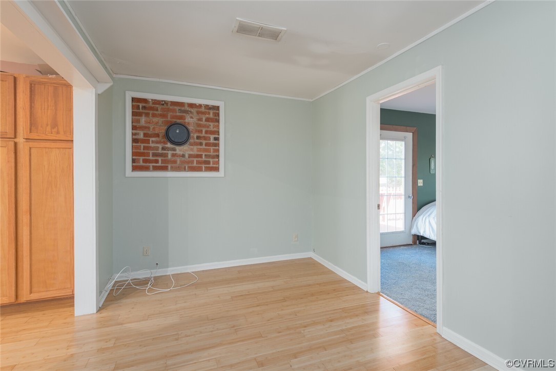 122 Fairview Road Louisa, VA 23093 - Photo 15 of 39 a view of an empty room with wooden floor and a window