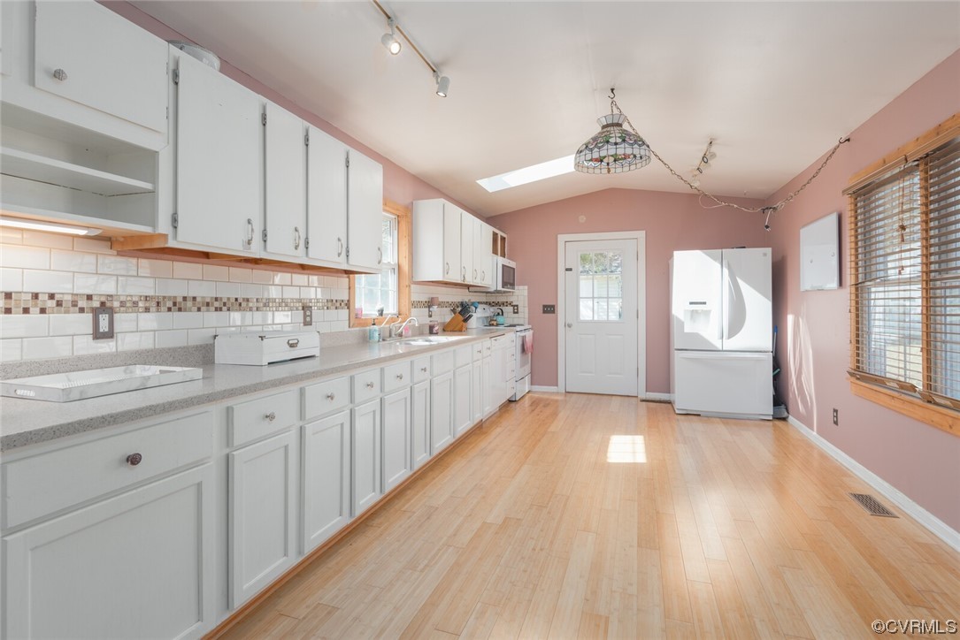 122 Fairview Road Louisa, VA 23093 - Photo 17 of 39 a open kitchen with cabinets a center island stainless steel appliances and a window