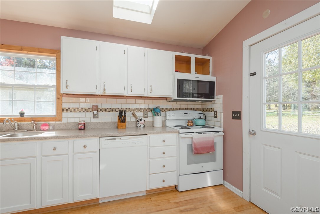 122 Fairview Road Louisa, VA 23093 - Photo 18 of 39 a kitchen with granite countertop white cabinets and sink