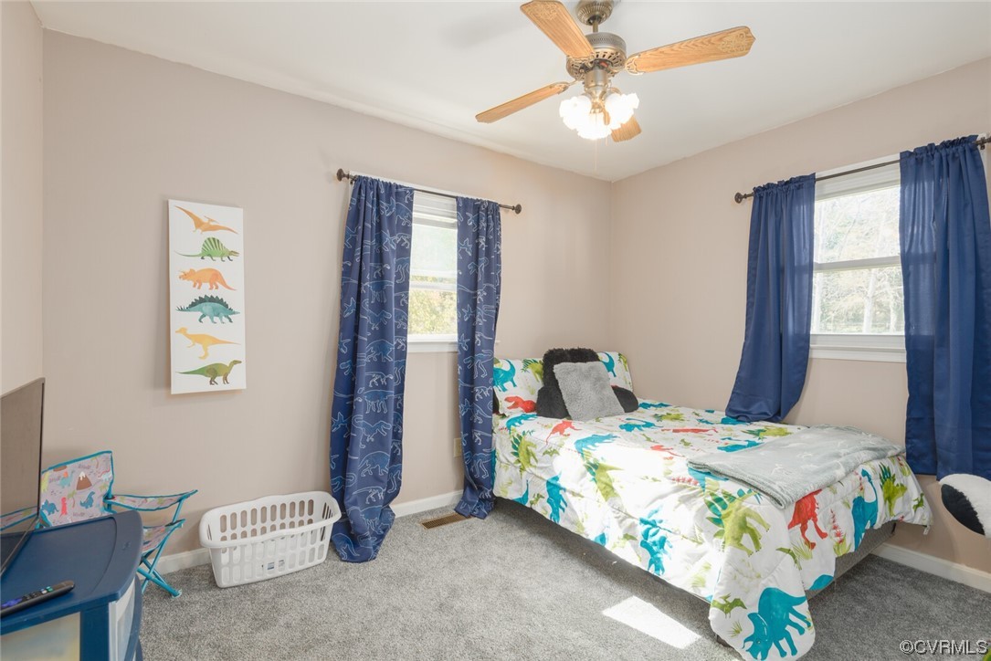 122 Fairview Road Louisa, VA 23093 - Photo 23 of 39 a bedroom that has a bed and a table in it
