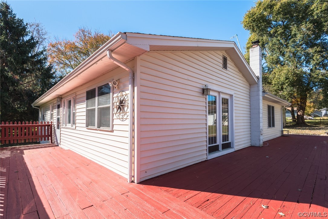122 Fairview Road Louisa, VA 23093 - Photo 4 of 39 a backyard of a house with wooden deck and outdoor seating