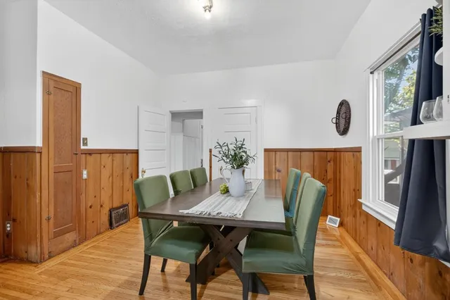 a bathroom with a sink mirror and toilet