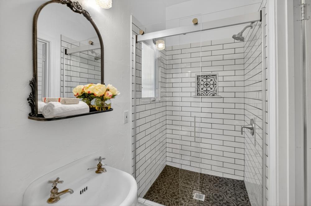 811 18th Street Sacramento, CA 95811 - Photo 19 of 71 a bathroom with a sink and mirror