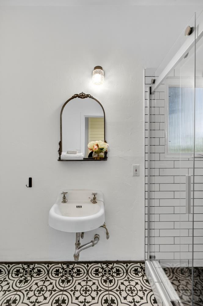 811 18th Street Sacramento, CA 95811 - Photo 21 of 71 a bathroom with a sink toilet and shower