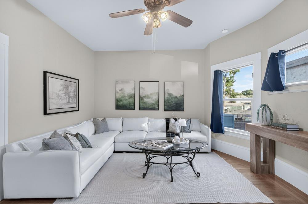 811 18th Street Sacramento, CA 95811 - Photo 23 of 71 a living room with furniture and a large window