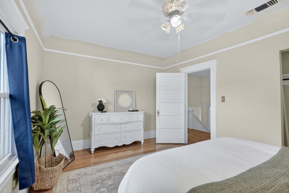 811 18th Street Sacramento, CA 95811 - Photo 35 of 71 a bedroom with bed and ceiling fan