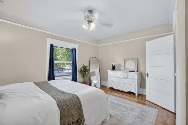 a view of a house with a wooden fence