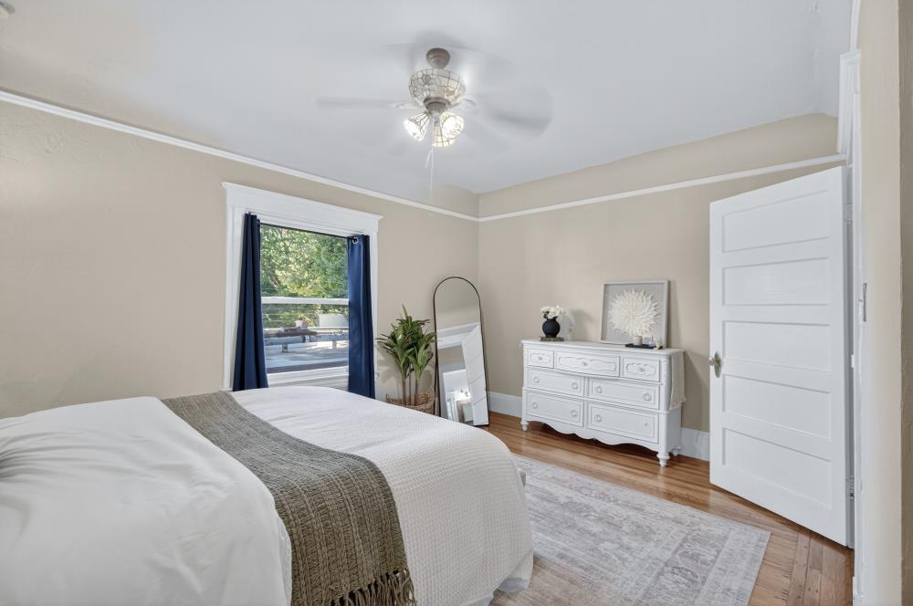 811 18th Street Sacramento, CA 95811 - Photo 36 of 71 a bedroom with a bed and a large window