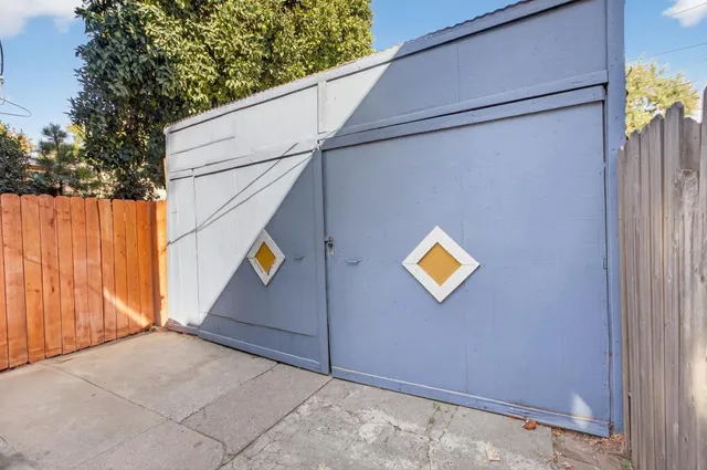 a view of a house with a tree