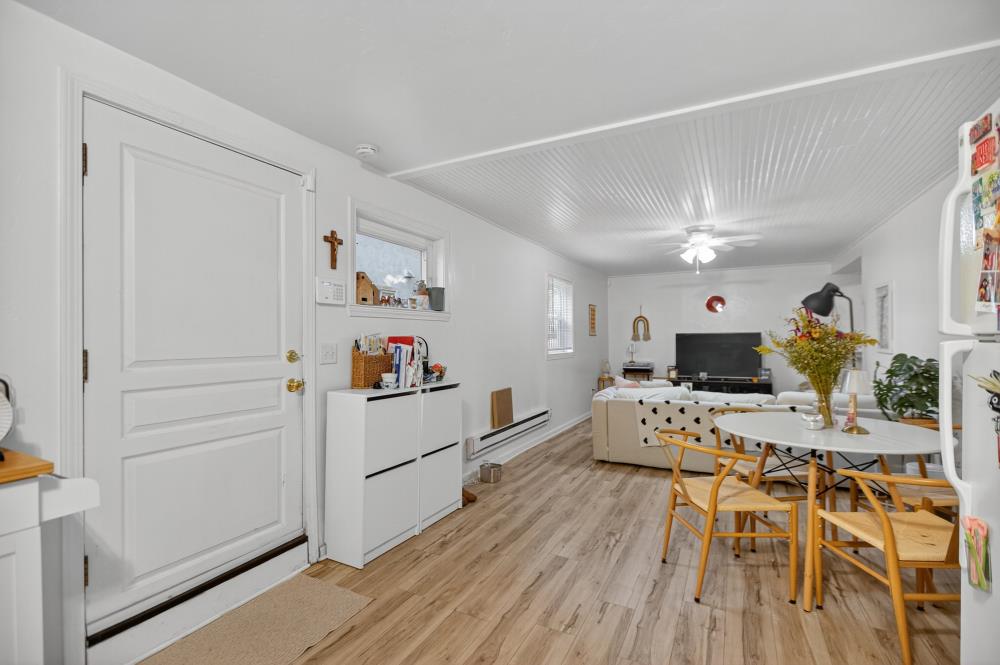 811 18th Street Sacramento, CA 95811 - Photo 50 of 71 a white kitchen with a table and chairs in it