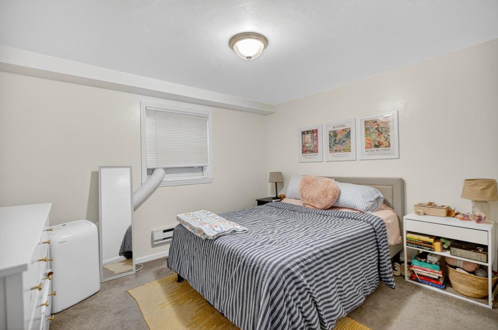 811 18th Street Sacramento, CA 95811 - Photo 54 of 71 a bedroom with a bed and a window