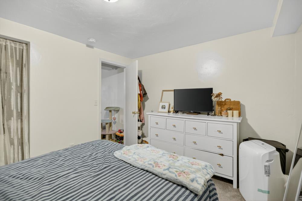 811 18th Street Sacramento, CA 95811 - Photo 55 of 71 a bedroom with a bed and flat screen tv