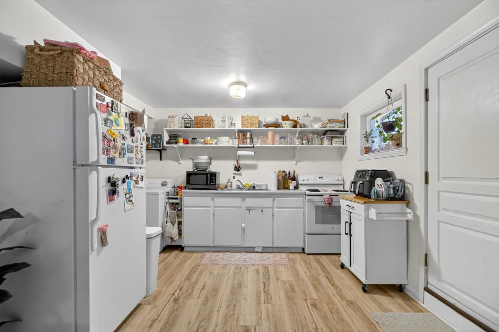 811 18th Street Sacramento, CA 95811 - Photo 56 of 71 a kitchen with stainless steel appliances a refrigerator and a stove top oven