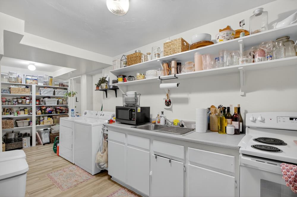 811 18th Street Sacramento, CA 95811 - Photo 57 of 71 a kitchen with a cabinets and wooden floor