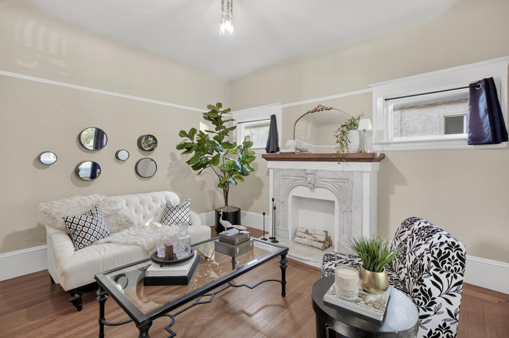 811 18th Street Sacramento, CA 95811 - Photo 10 of 71 a living room with furniture and a fireplace