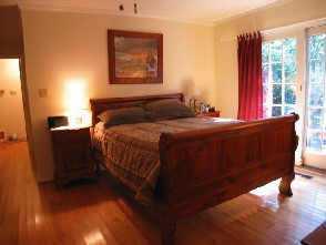 2625 Walker Road Matthews, NC 28105 - Photo 7 of 8 a bedroom with a bed and a window