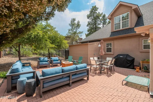 a view of front door of house with an outdoor seating