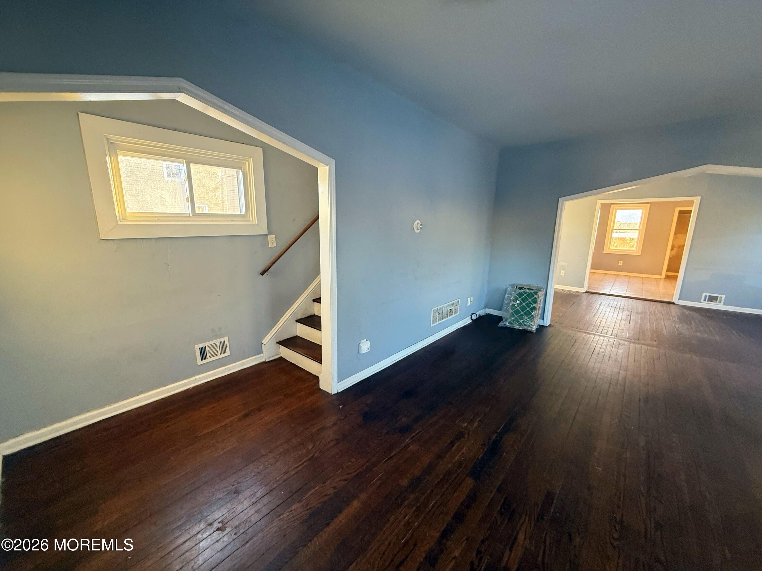 401 Ridge Avenue Asbury Park, NJ 07712 - Photo 3 of 11 a view of an empty room with wooden floor and a window
