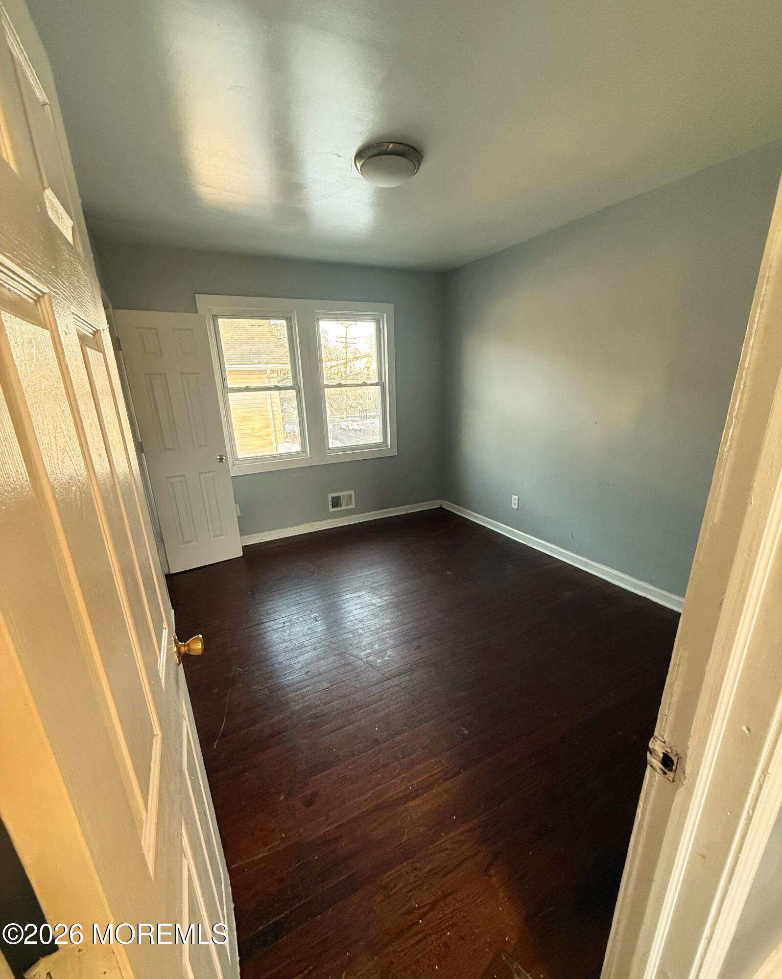 401 Ridge Avenue Asbury Park, NJ 07712 - Photo 7 of 11 en empty room with windows