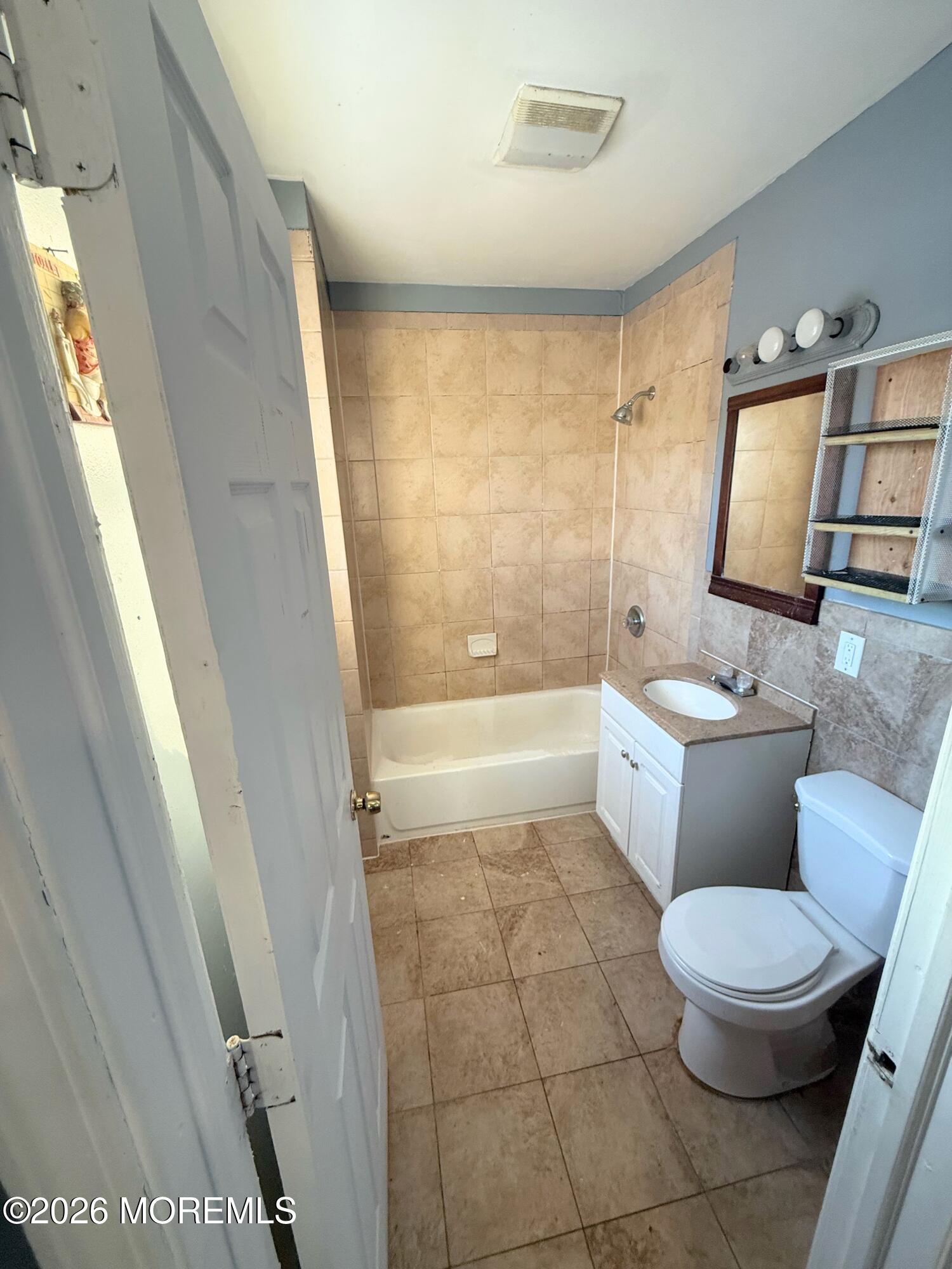 401 Ridge Avenue Asbury Park, NJ 07712 - Photo 9 of 11 a bathroom with a toilet a sink and a shower