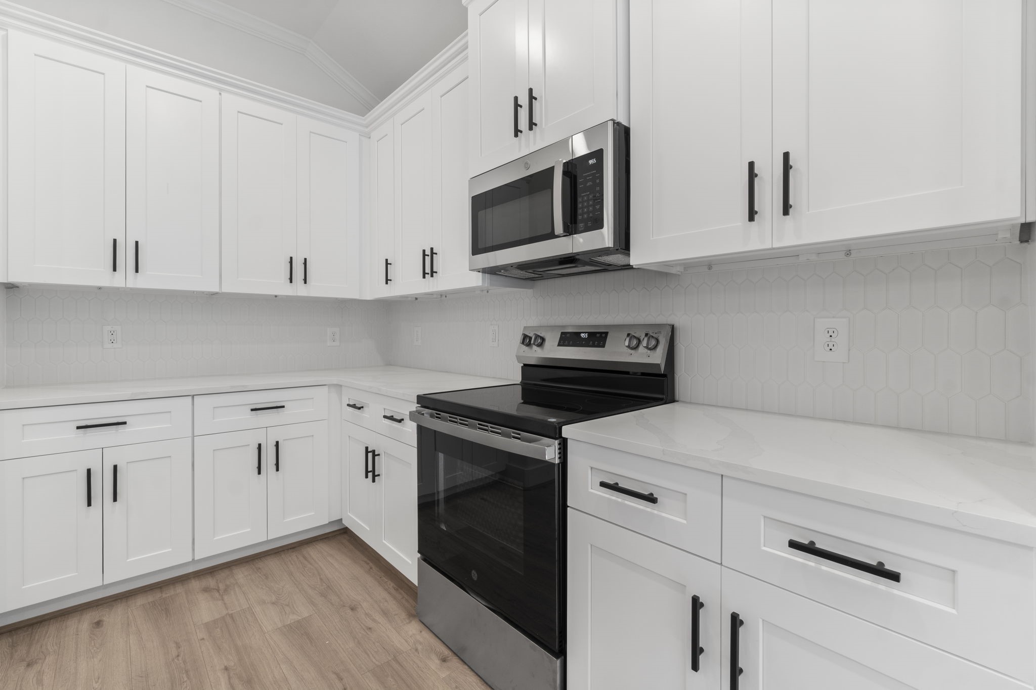 241 Clear Springs Trinity, TX 75862 - Photo 9 of 46 a kitchen with white cabinets and stainless steel appliances