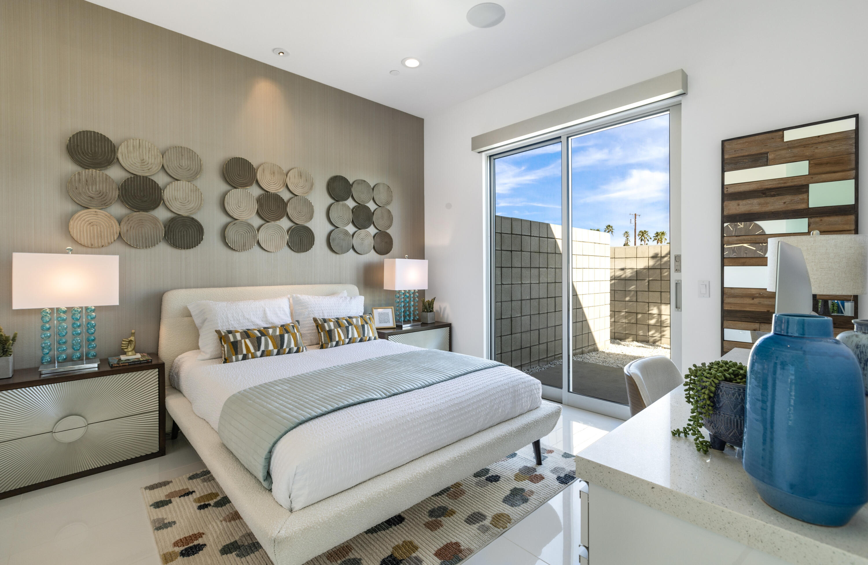 2696 Anza Trail Palm Springs, CA 92264 - Photo 23 of 99 a bedroom with a bed and glass window