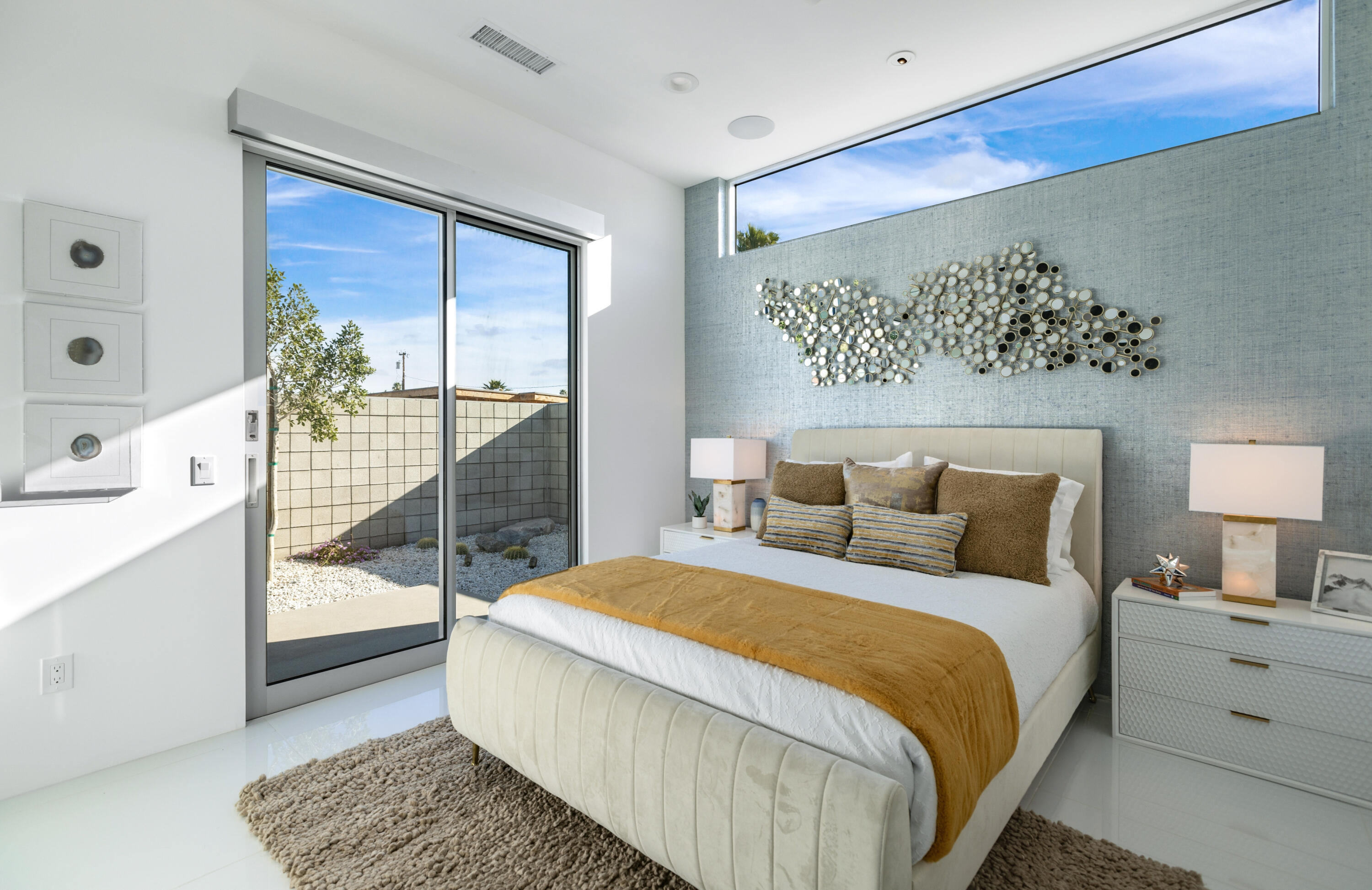 2696 Anza Trail Palm Springs, CA 92264 - Photo 26 of 99 a spacious bedroom with a bed and a walk in closet