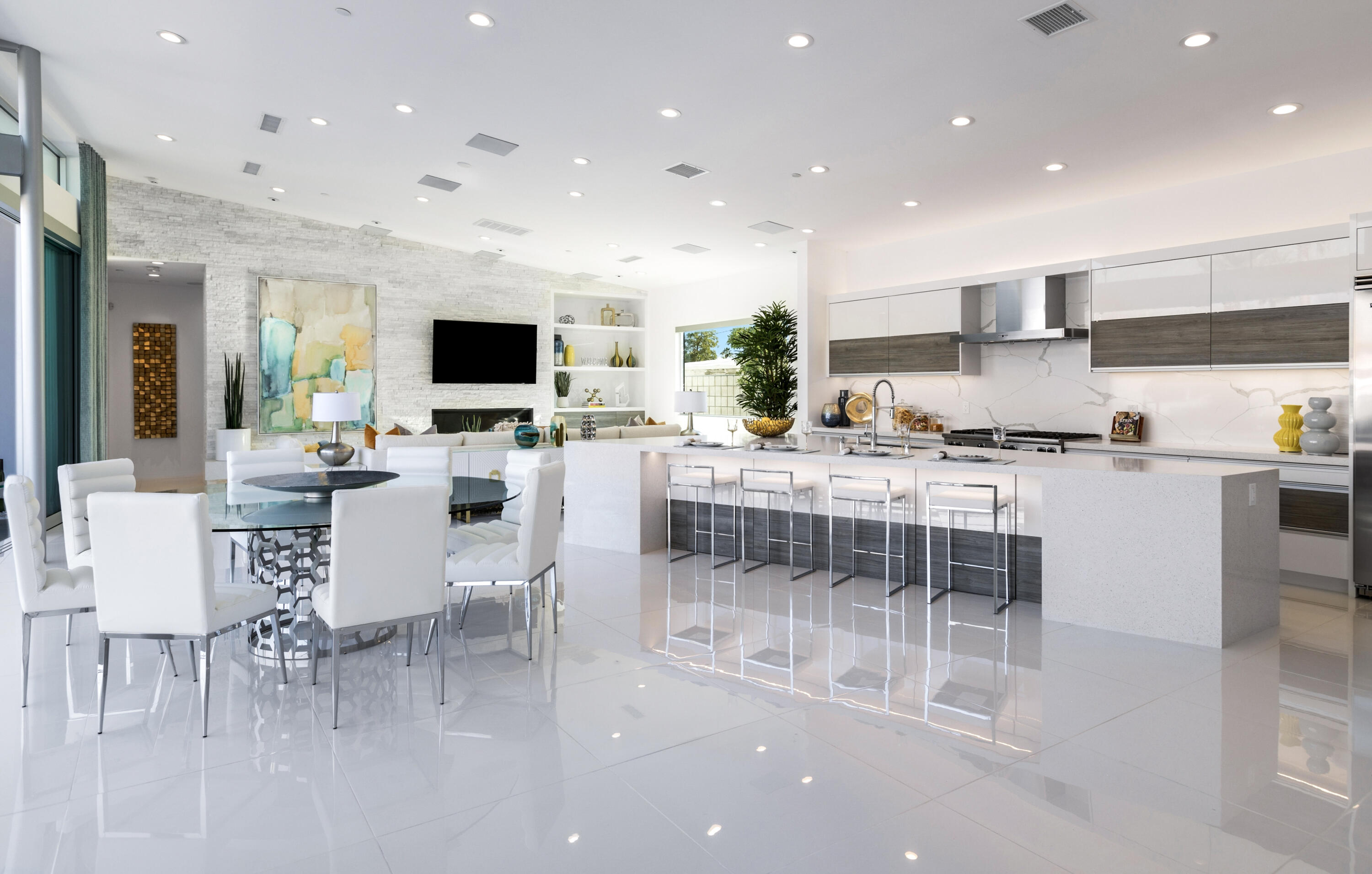 2696 Anza Trail Palm Springs, CA 92264 - Photo 7 of 99 a kitchen with stainless steel appliances kitchen island granite countertop a stove a sink a dining table and chairs