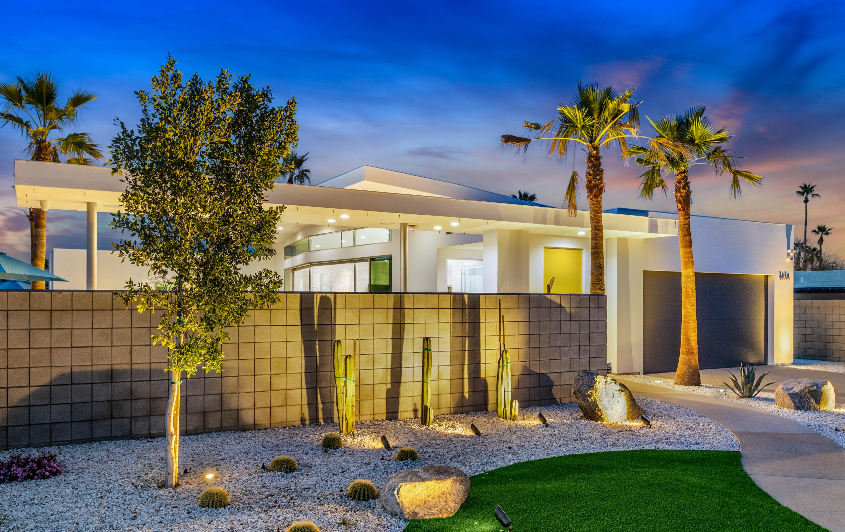 2696 Anza Trail Palm Springs, CA 92264 - Photo 74 of 99 a front view of a house with a garden