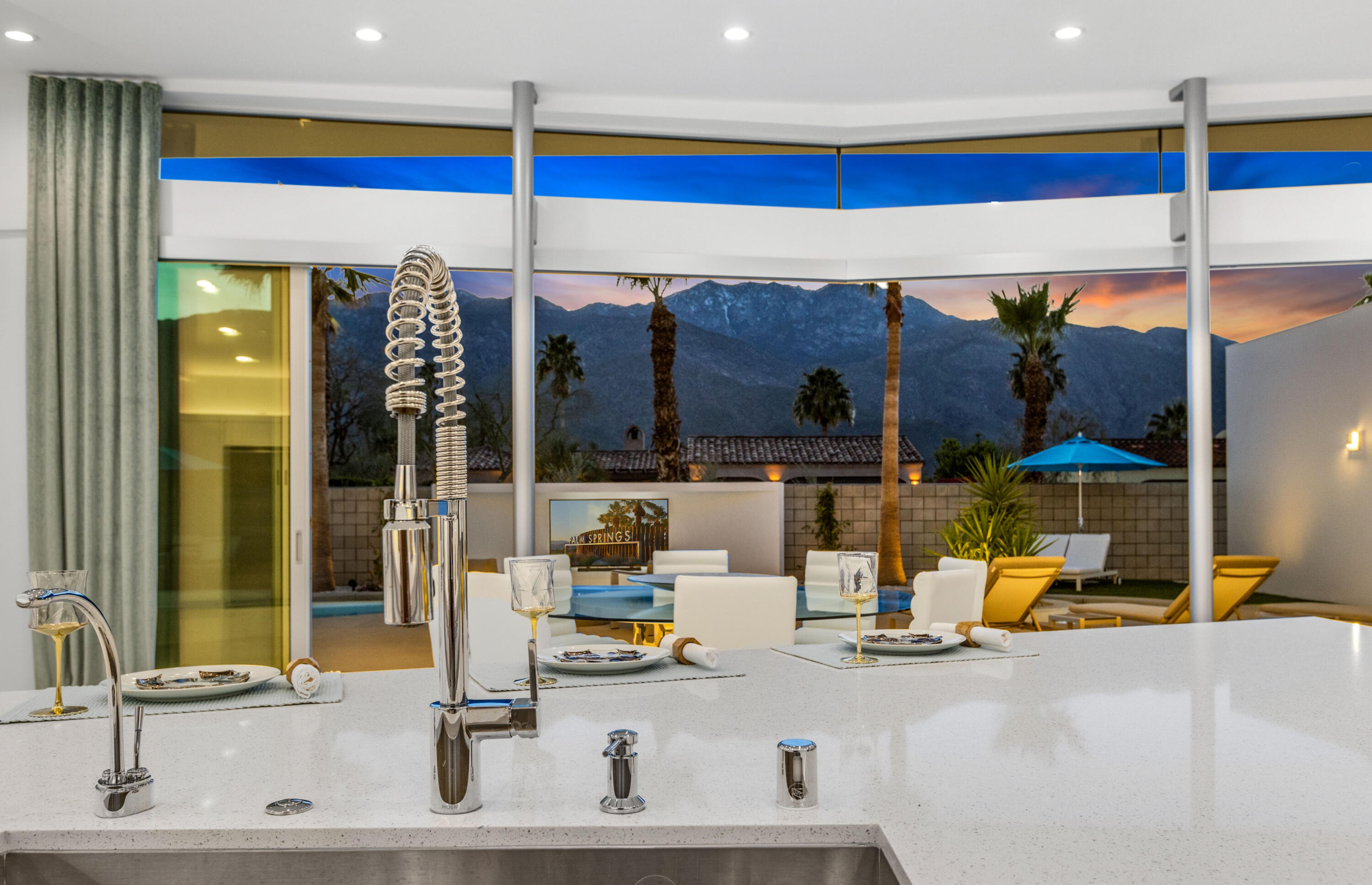 2696 Anza Trail Palm Springs, CA 92264 - Photo 84 of 99 a room with lots of windows and glass door