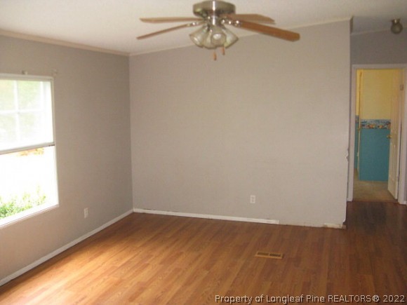 120 Westview Road Carthage, NC 28327 - Photo 5 of 11 wooden floor in an empty room with a window