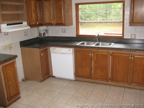 120 Westview Road Carthage, NC 28327 - Photo 7 of 11 a kitchen with granite countertop a sink window and cabinets