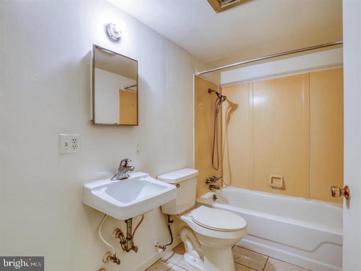103 North Church Street Berryville, VA 22611 - Photo 12 of 13 a bathroom with a sink toilet and a bathtub