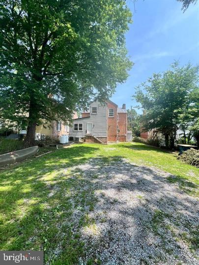 103 North Church Street Berryville, VA 22611 - Photo 13 of 13 a view of a house with a big yard and large trees