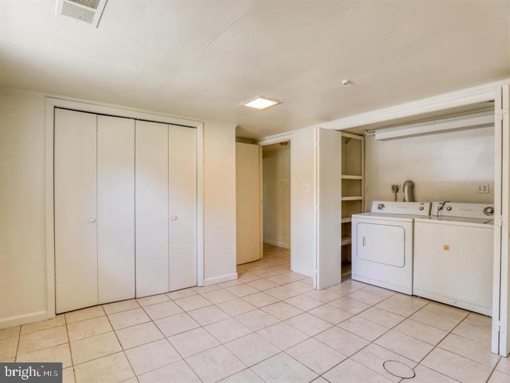 103 North Church Street Berryville, VA 22611 - Photo 8 of 13 a view of a kitchen with white cabinets