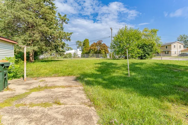 a view of a big yard with a house