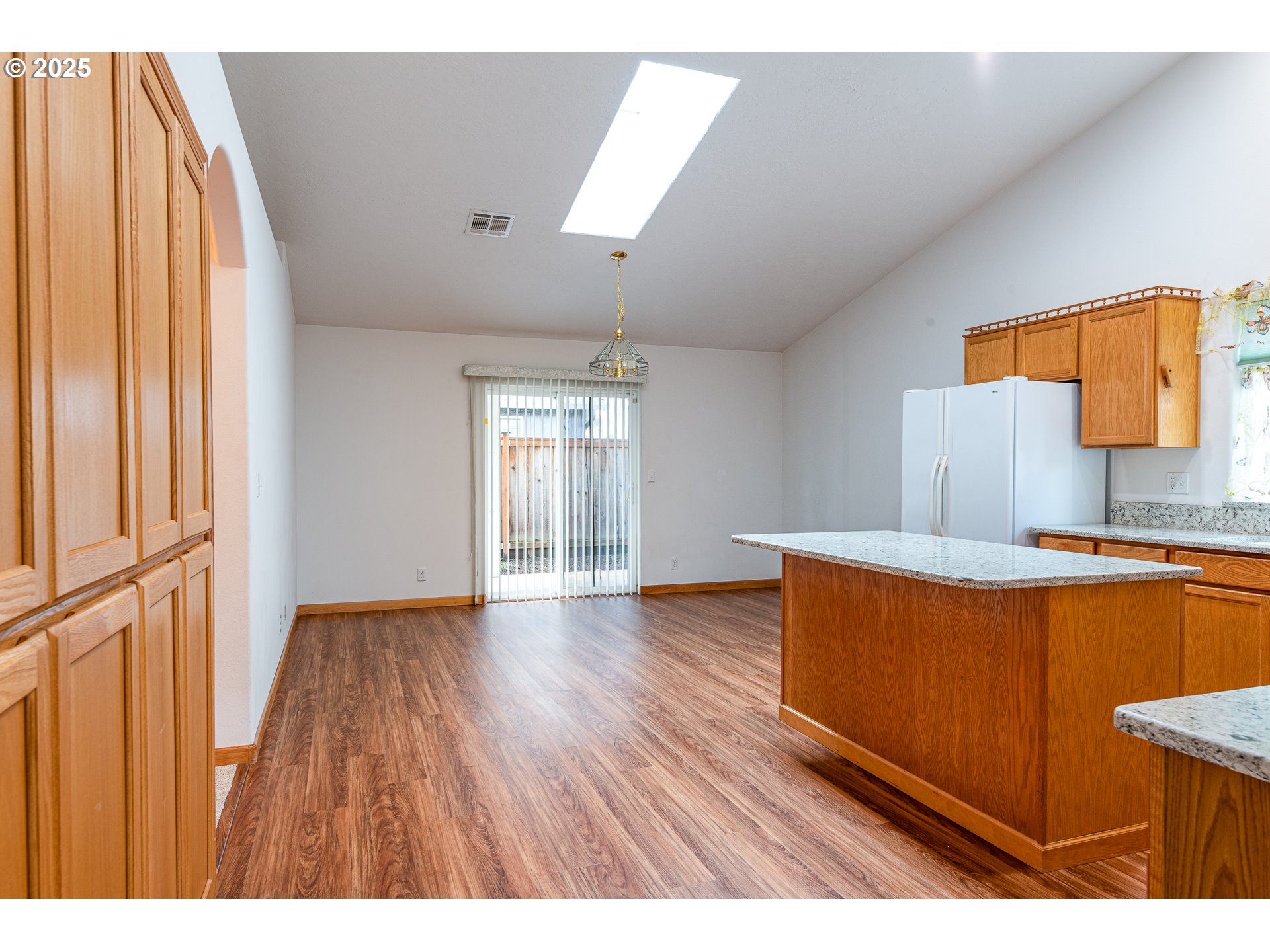 6565 Aaron Lane Springfield, OR 97478 - Photo 13 of 48 a kitchen with stainless steel appliances granite countertop a stove a sink and a large window