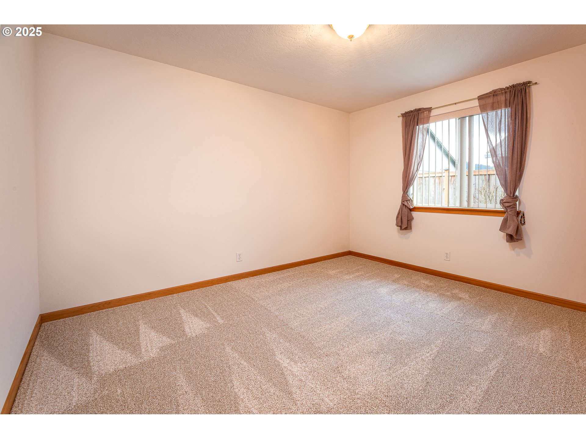 6565 Aaron Lane Springfield, OR 97478 - Photo 32 of 48 a view of an empty room with a window