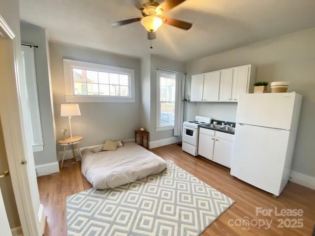 a bed room with a bed and a window