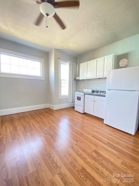 823 Central Avenue Charlotte, NC 28204 - Photo 3 of 14 a view of a kitchen with a microwave and a stove