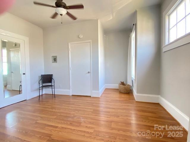 823 Central Avenue Charlotte, NC 28204 - Photo 4 of 14 a view of livingroom with hardwood floor and a ceiling fan